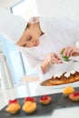 Pastry cook preparing a cake Royalty Free Stock Photo
