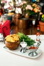 Pastry with greens and sacks on a wooden surface Royalty Free Stock Photo