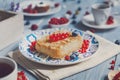 Pastry pie, tea, coffee and berries at blue rustic wood Royalty Free Stock Photo