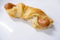Pastry sausage puff on white