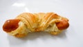 Pastry sausage puff on white