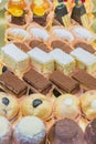 Pastry shop display window with variety of mini desserts and cakes, candy bar, selective focus Royalty Free Stock Photo