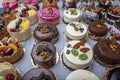 Pastry shop with selection of cream or fruit cake. Colorful beautiful cakes displayed on the marble countertop Royalty Free Stock Photo