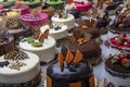 Pastry shop with selection of cream or fruit cake. Colorful beautiful cakes displayed on the marble countertop Royalty Free Stock Photo