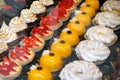 Pastry shop with variety of tartlets, jelly, eclairs, cakes with strawberries Royalty Free Stock Photo