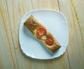 Pastry tart with cheese and tomatoes Royalty Free Stock Photo