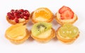 Pastry tartlets with fresh fruit isolated on white