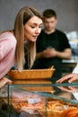 Pastry. Woman Choosing Fresh Bakery In Shop. Royalty Free Stock Photo