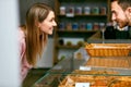 Pastry. Woman Choosing Fresh Bakery In Shop. Royalty Free Stock Photo