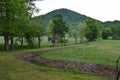 Pasture view with barn and mountain Royalty Free Stock Photo