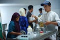 Activities of residents and employees are sorting cow`s milk