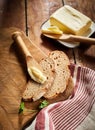 Pat of farm butter with slices of rye bread Royalty Free Stock Photo