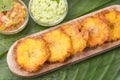 Patacon or toston fried and flattened pieces of green plantain, traditional snack or accompaniment in the Caribbean, guacamole and Royalty Free Stock Photo