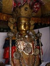 Golden metal Buddha sculpture inside Hiranya Varna Mahavihar. Golden Temple. Patan, Kathmandu. Nepal