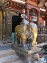 Vertical view. Sculpture of a monk on an elephant inside Hiranya Varna Mahavihar. Golden Temple. Patan, Kathmandu. Nepal