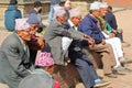 PATAN, NEPAL - DECEMBER 20, 2014: Nepalese men gathering and wearing Dhaka Topi traditional Nepalese hat at Durbar Square