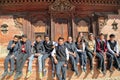 PATAN, NEPAL - DECEMBER 21, 2014: Nepalese students posing in front of a temple at Durbar Square Royalty Free Stock Photo