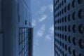 patch of blue sky between two modern buildings abstract architectural detail tint Royalty Free Stock Photo