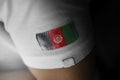 Patch of the national flag of the Afghanistan on a white t-shirt