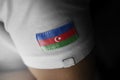Patch of the national flag of the Azerbaijan on a white t-shirt