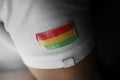 Patch of the national flag of the Bolivia on a white t-shirt