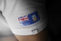 Patch of the national flag of the Falkland Islands on a white t-shirt