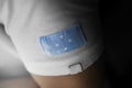 Patch of the national flag of the Federated States Micronesia on a white t-shirt