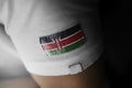 Patch of the national flag of the Kenya on a white t-shirt
