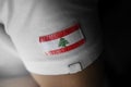 Patch of the national flag of the Lebanon on a white t-shirt Royalty Free Stock Photo