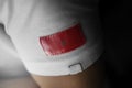 Patch of the national flag of the Morocco on a white t-shirt