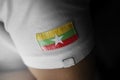 Patch of the national flag of the Myanmar on a white t-shirt