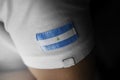 Patch of the national flag of the Nicaragua on a white t-shirt
