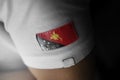 Patch of the national flag of the Papua New Guinea on a white t-shirt