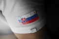 Patch of the national flag of the Slovakia on a white t-shirt