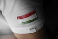 Patch of the national flag of the Tajikistan on a white t-shirt