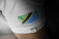 Patch of the national flag of the Tanzania on a white t-shirt
