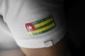 Patch of the national flag of the Togo on a white t-shirt