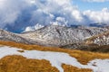 Patches of snow building up on slopes of Snowy Mountains at Mount Kosciuszko National Park, Australia Royalty Free Stock Photo