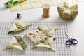Patchwork block sewing process, pincushion, sewing and quilting accessories Royalty Free Stock Photo