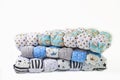 Patchwork and fashion concept - beautiful stack of colorful quilts, bedspreads stacked in several rows in height for storage, sale Royalty Free Stock Photo