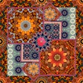 Patchwork pattern with stylized flowers and ornamental frame.