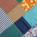 Patchwork quilt featuring a variety of distinct textiles. Includes a brown textured Royalty Free Stock Photo