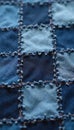 Patchwork textile made from recycled denim squares. Various blue shades stitched together with visible thread. Geometric pattern Royalty Free Stock Photo