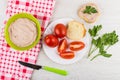 Pate in bowl, tomatoes, bread, parsley, sandwich with liver pate