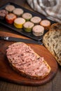 Pate on a slice of bread on wooden table Royalty Free Stock Photo