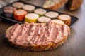 Pate on a slice of bread on wooden table Royalty Free Stock Photo