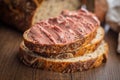 Pate on a slice of bread on wooden table Royalty Free Stock Photo