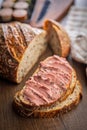 Pate on a slice of bread on wooden table Royalty Free Stock Photo