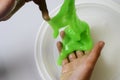 Pate slime elastic and viscous on child`s hand