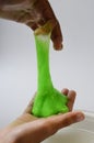 Pate slime elastic and viscous on child`s hand